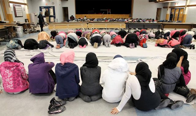 Students at Toronto’s Valley Park Middle School pray in the cafeteria every Friday during class hours — boys in front, girls behind them and a barrier, and menstruating girls at the very back to watch but not participate. (Photo: courtesy of John Goddard)